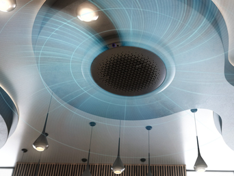 Samsung 360-Grad-Kassette an der Decke mit visualisierter Luftzirkulation in alle Richtungen. Modernes Design mit umliegenden Lampen für gleichmäßige Raumklimaverteilung | © Samsung